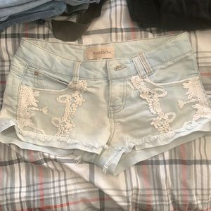 Jean shorts, lace design on front, worn